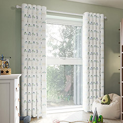 A beautiful set of white taped wooden blinds in a very bright room