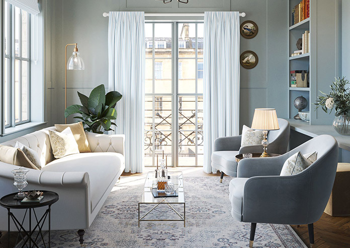 A beautiful set of white taped wooden blinds in a very bright room