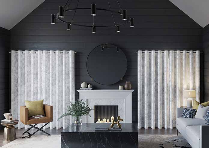A beautiful set of white taped wooden blinds in a very bright room