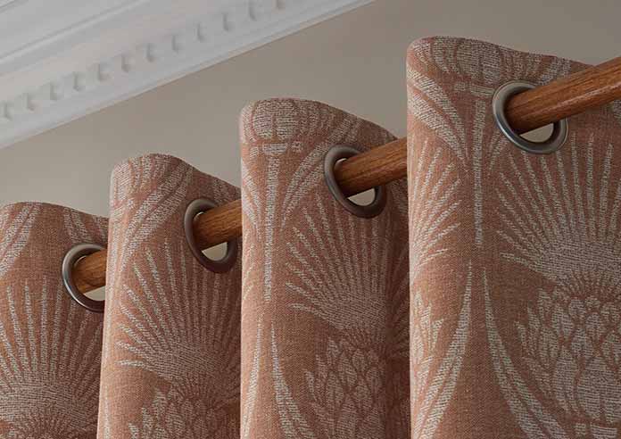 A beautiful set of white taped wooden blinds in a very bright room